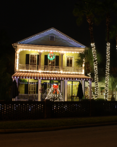 19th century style building lit up with Christmas lights.
