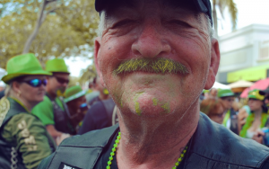 Image contains a man with a green beard.