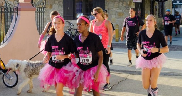 image of women dressed in black t-shirts and pink tu-tus for Pink Up The Pace