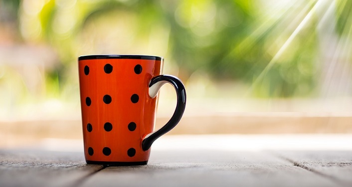 image of red, with black dots coffee cup used for Coffee with a Park Ranger