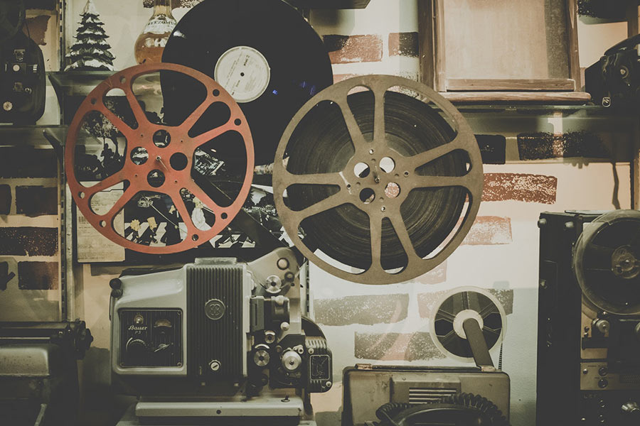 Two reels of film and film equipment.