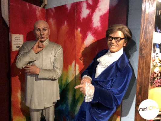 Image contains two life-size wax replicas of characters from the movie Austin Powers