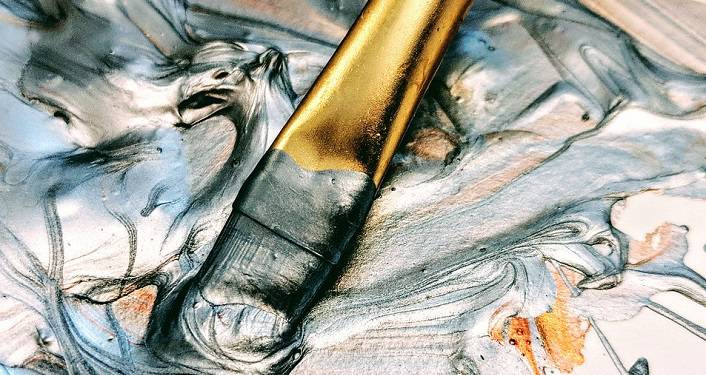 paint brush swirling paint onto a painting; What Makes It Art? Discussion