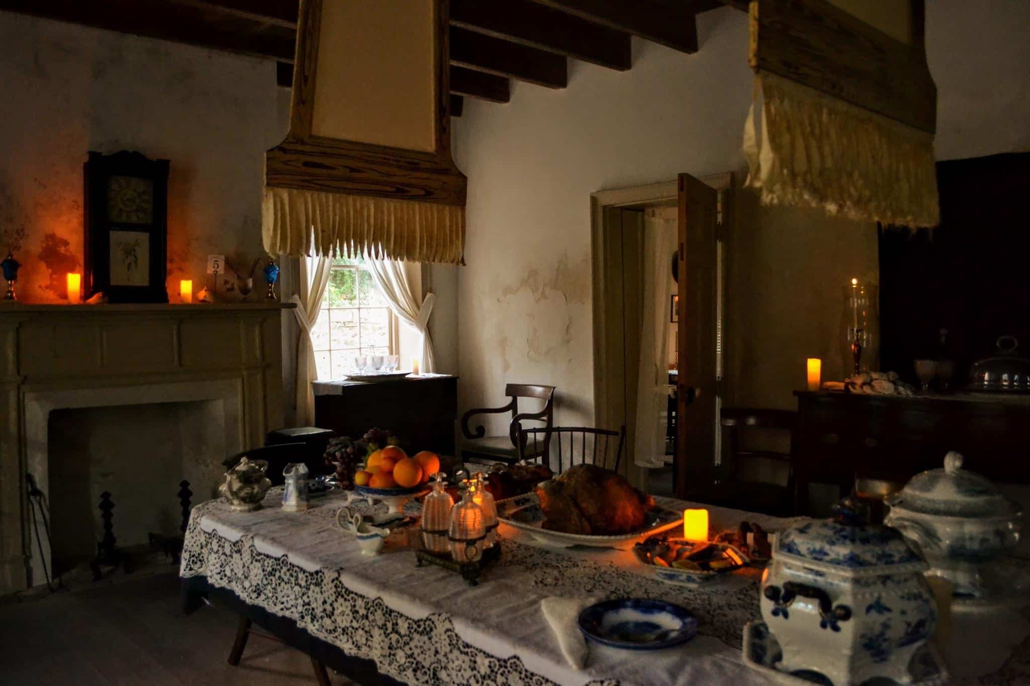 A set dining room table inside the Ximenez-Fatio House Museum located in St. Augustine, FL.