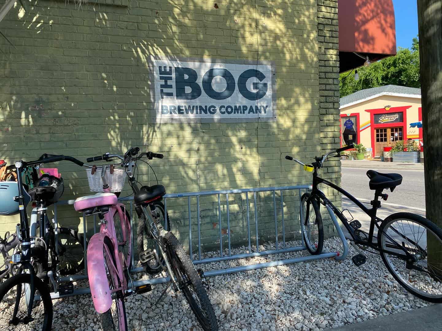 Outside of the Bog Brewing Company with bikes lined along the wall.