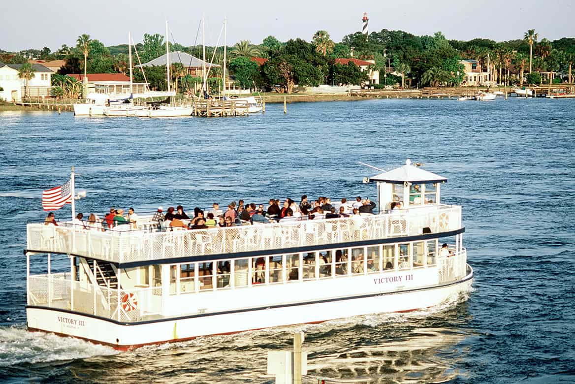 People enjoying a scenic boat tour in St. Augustine