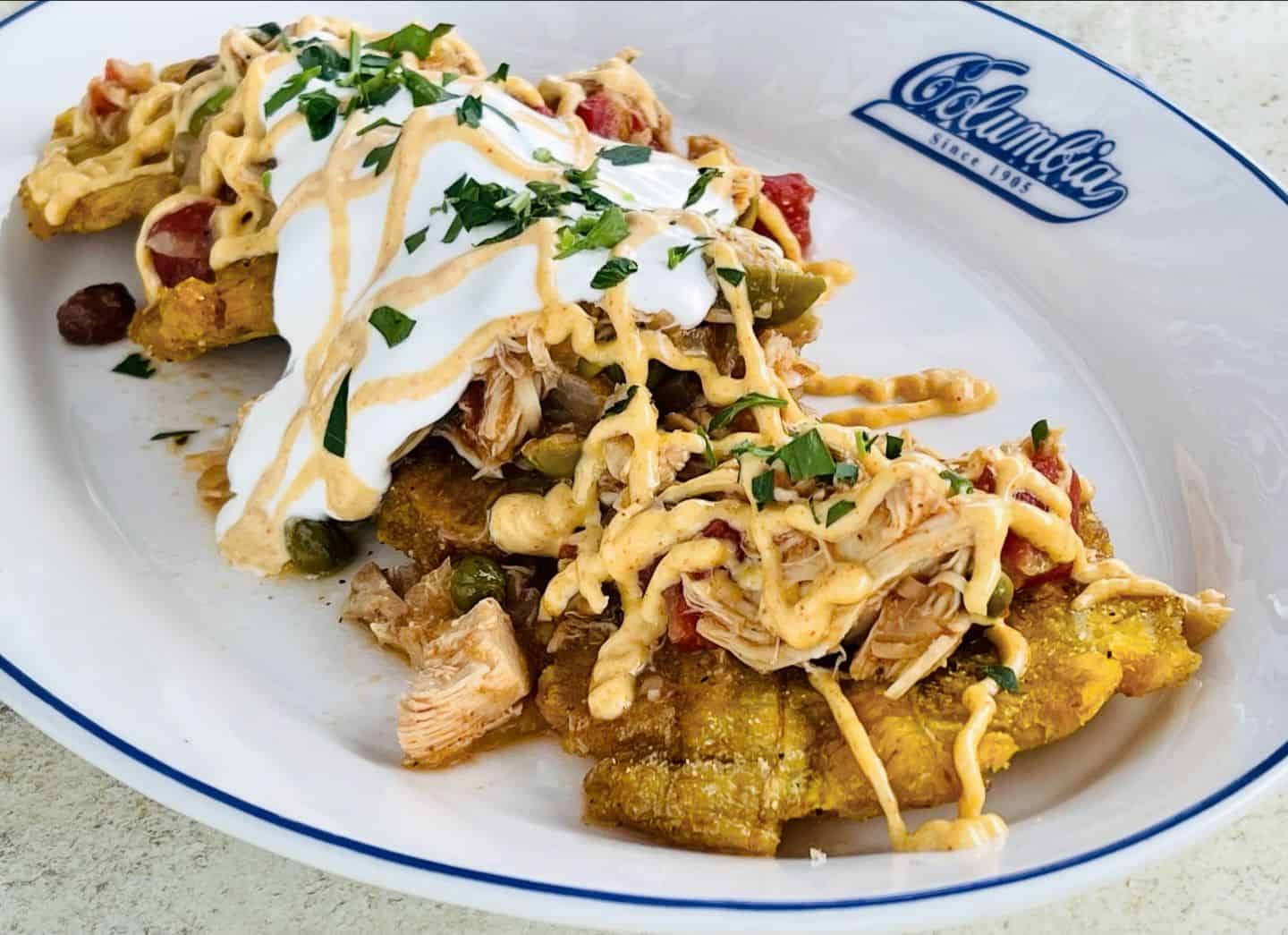 Twice-fried green plantains seasoned lightly with salt, topped with Picadillo de Pollo, lime crema and smoked Spanish paprika at the Columbia Restaurant in St. Augustine.