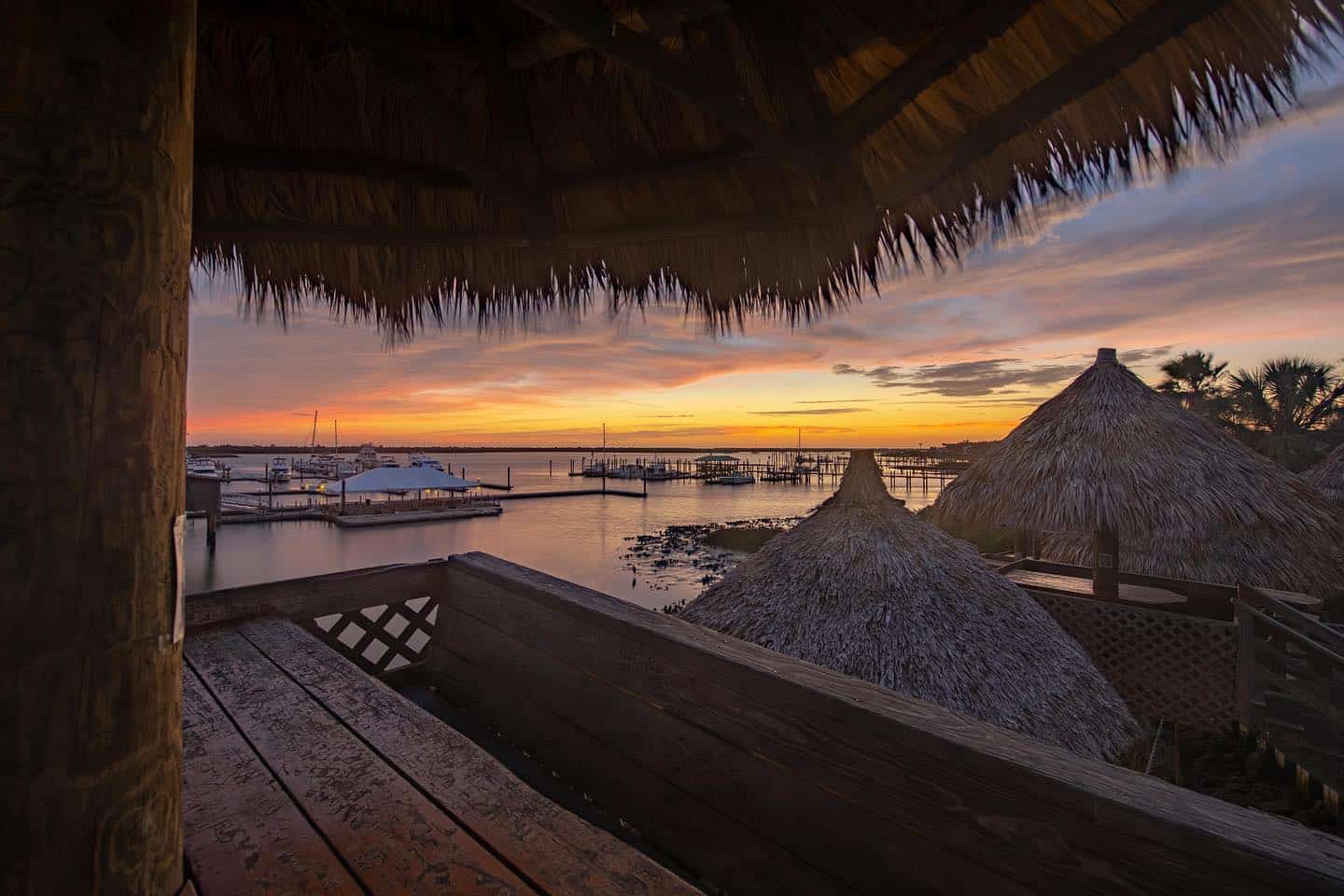 A sunset view under a tiki hut at the Conch House in St. Augustine, FL.