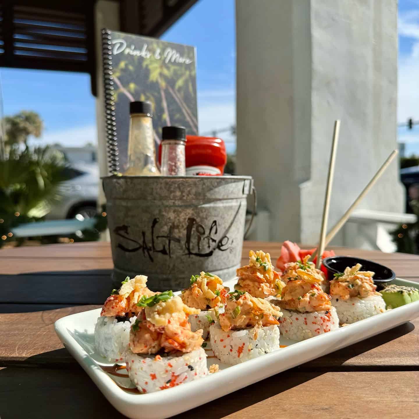 Platter of sushi on a patio table at Salt Life Food Shack in St. Augustine.