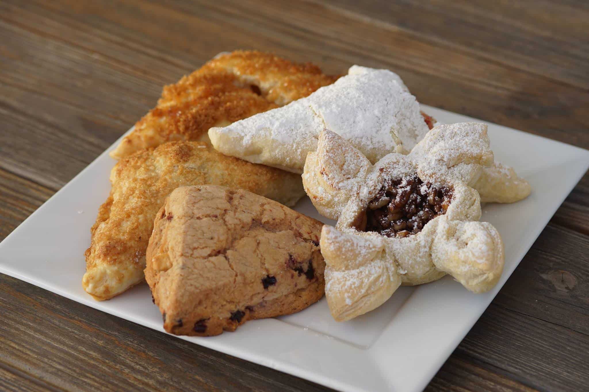 An assortment of Spanish pastries on a plate.